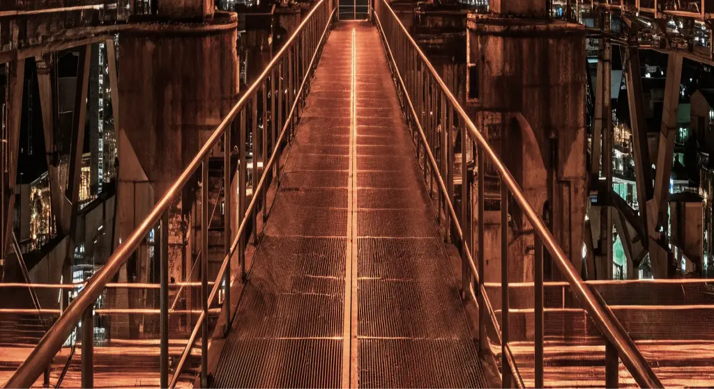 Illuminated pedestrian bridge at night